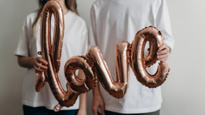 Couple holding Love sign