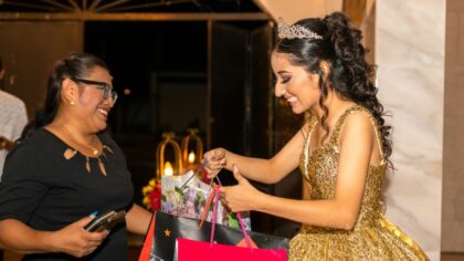 A Spanish girl receiving birthday presents from an older woman
