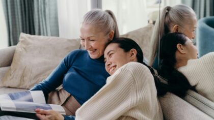 Mom and daughter laughing together