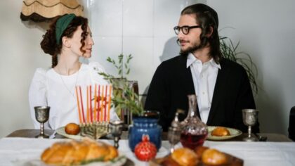 Newly wedded couple sitting at a table