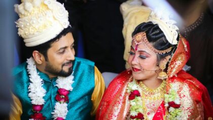 Bride and Groom in Traditional Clothing during a Wedding Ceremony